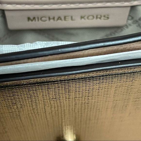 MICHAEL Michael Kors
Medium Grace Metallic Rose Gold Leather Envelope Cl… - Picture 8 of 11